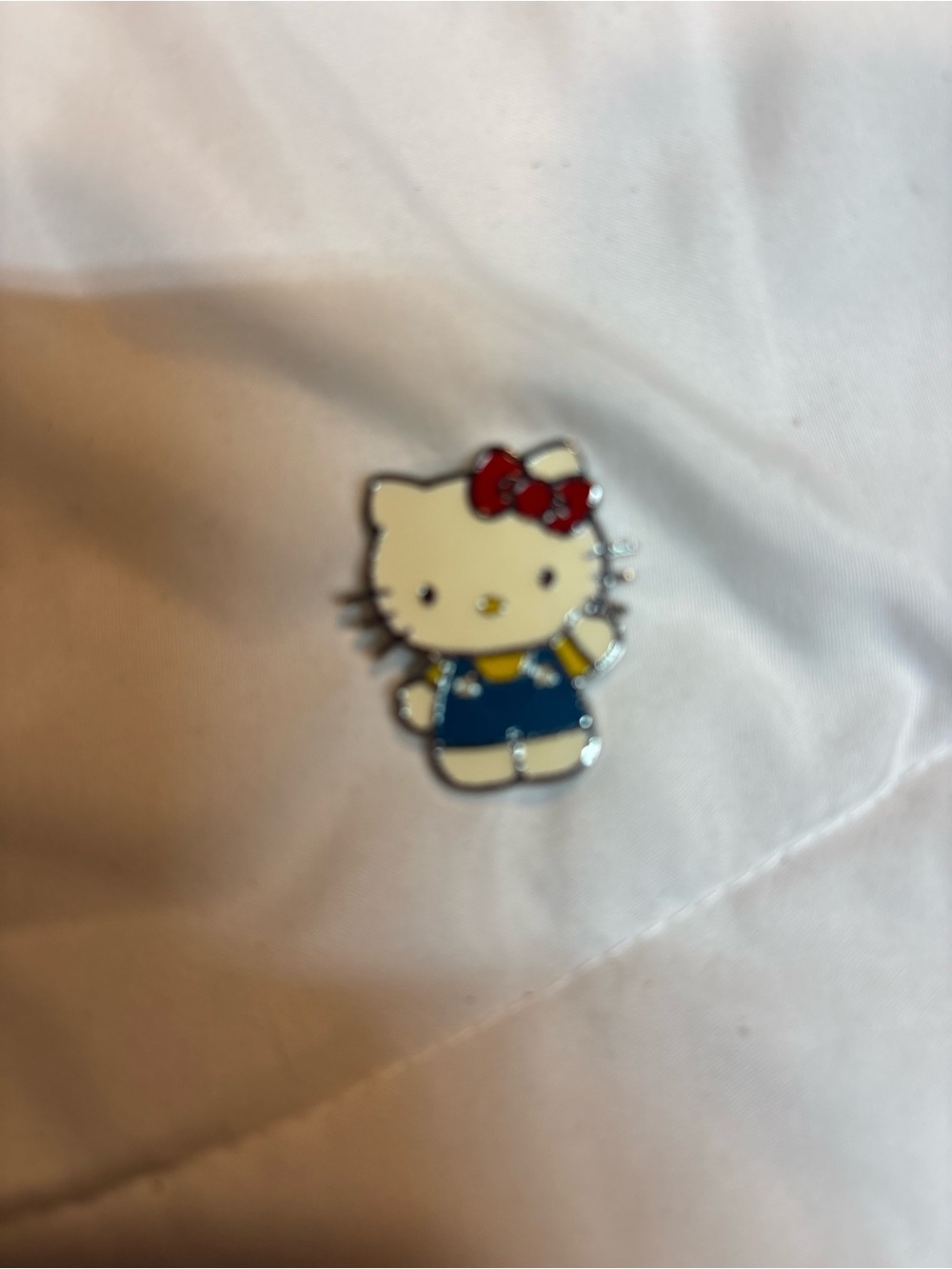 Hello Kitty White, Red & Blue Enamel Pin approximately 1 1/2”